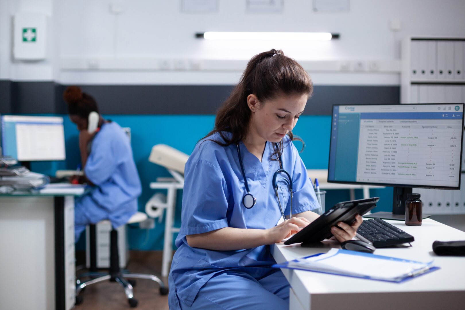 a nurse sits at her desk